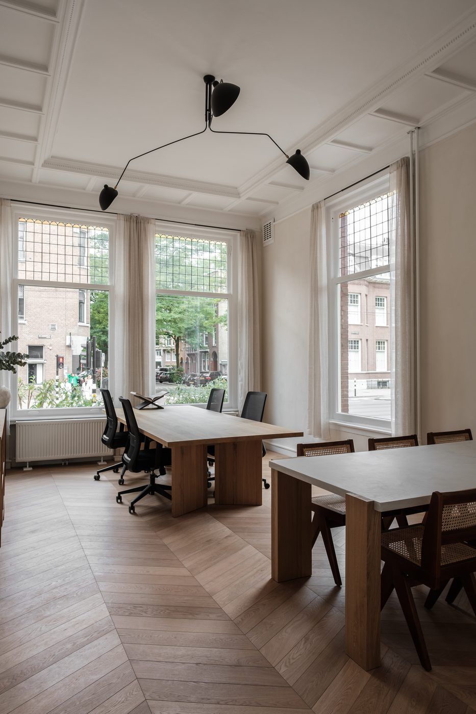 Private office with oak desks and tall bay windows in a CreativeGrounds villa, Amsterdam Oud-Zuid