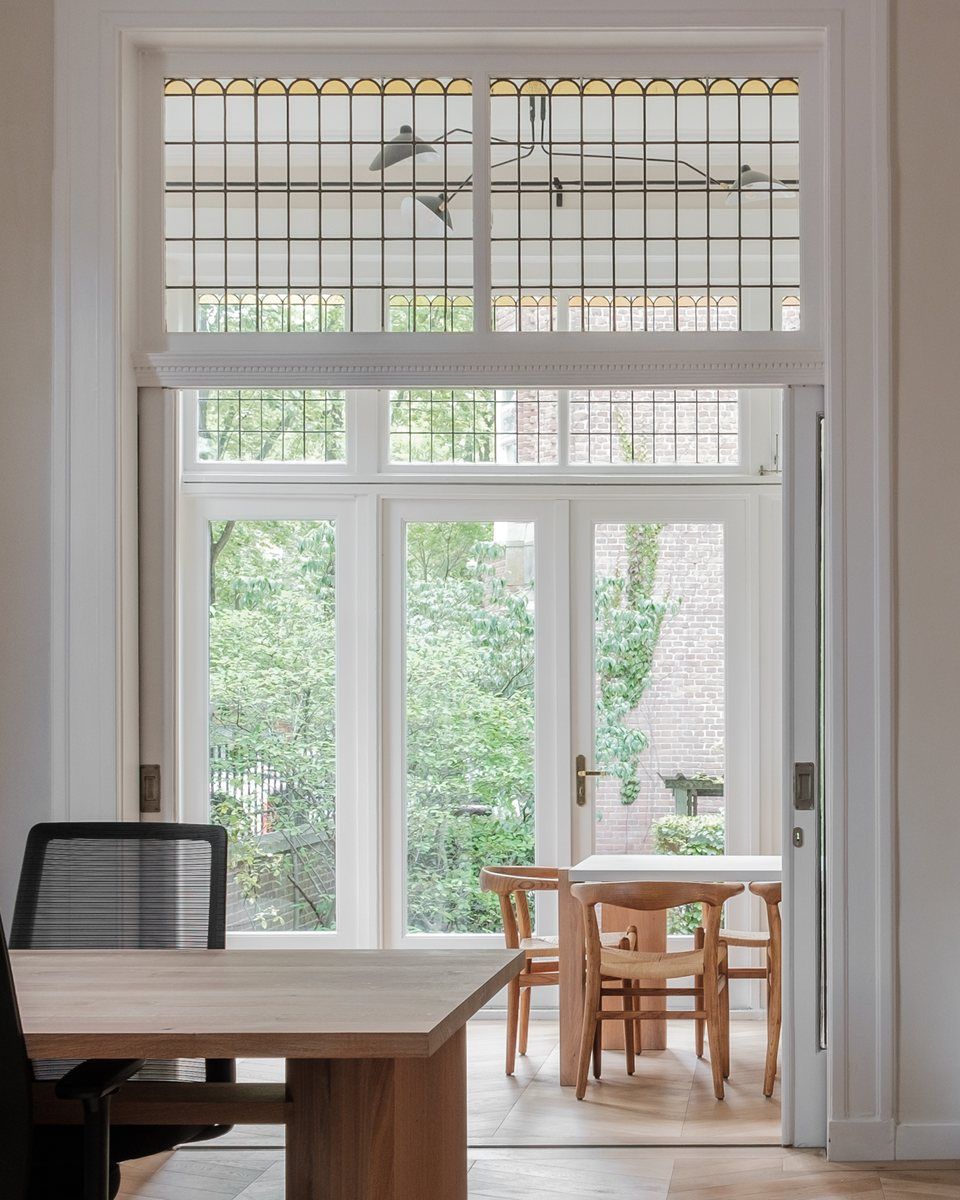 Grand Suite at CreativeGrounds, view through stained-glass garden doors into the next room